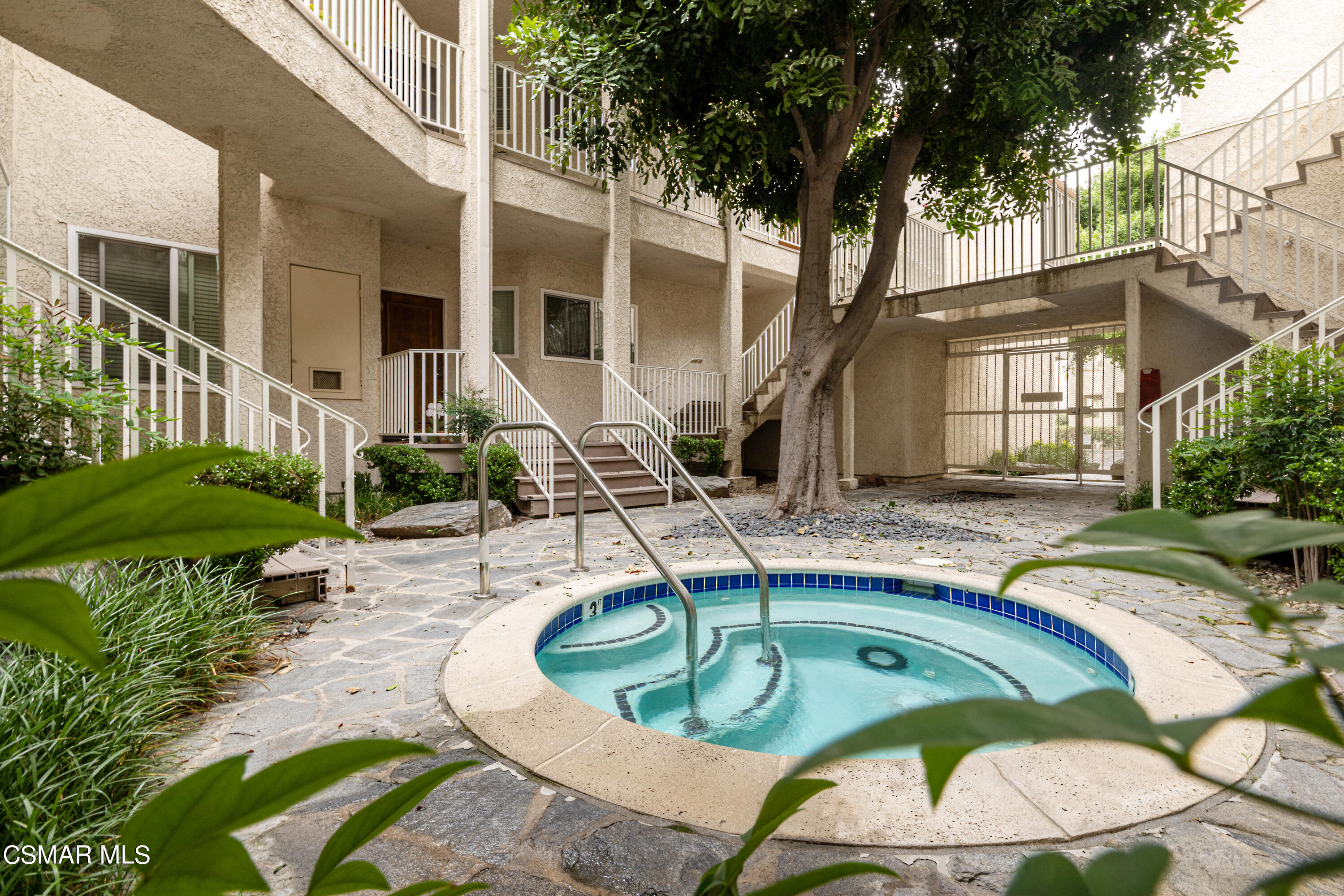 3330 Darby Street, Unit 409 Simi Valley, CA 93063 - Photo 3 of 27 a view of a house with backyard swimming pool and sitting area