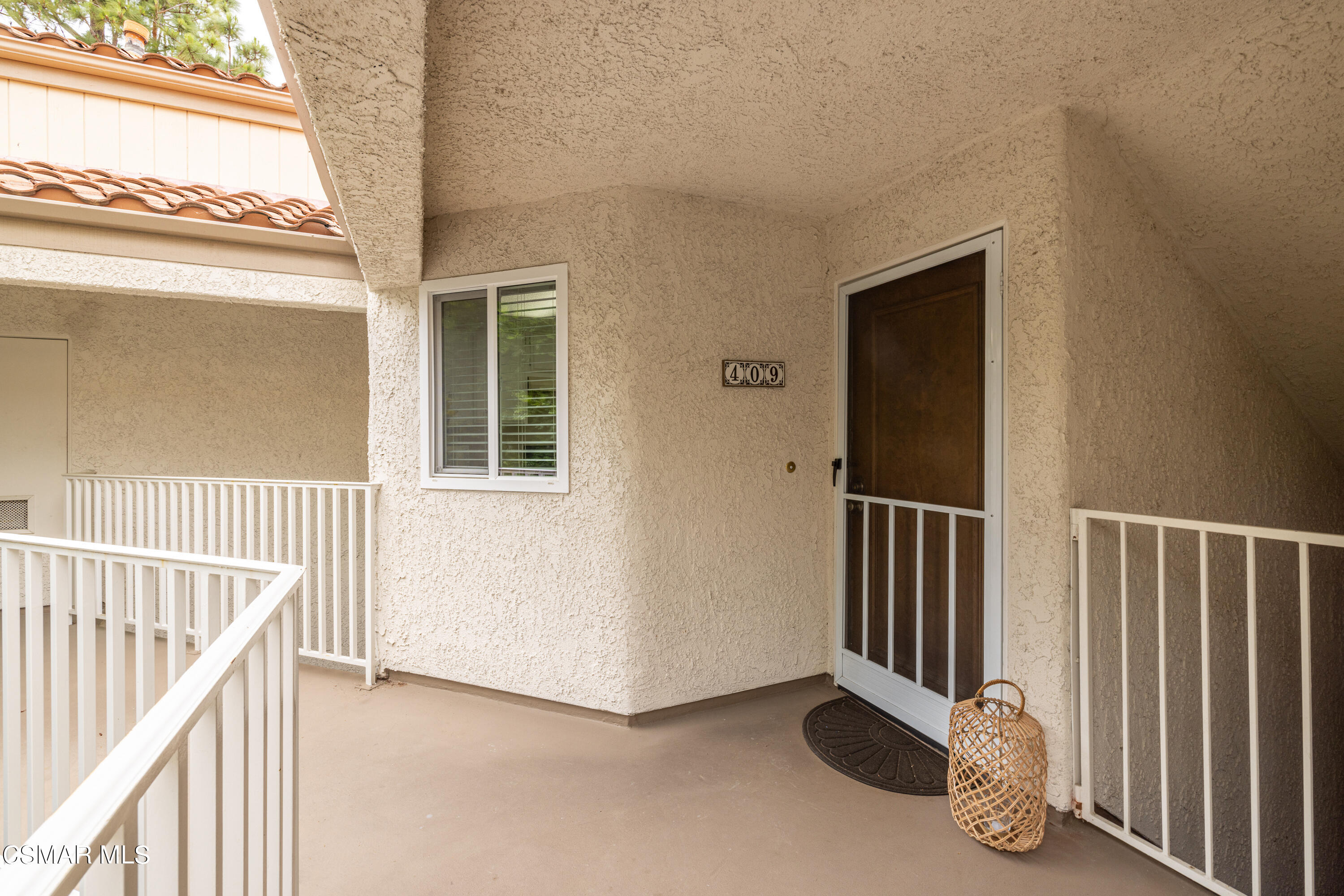 3330 Darby Street, Unit 409 Simi Valley, CA 93063 - Photo 6 of 27 a view of a livingroom with wooden floor and windows