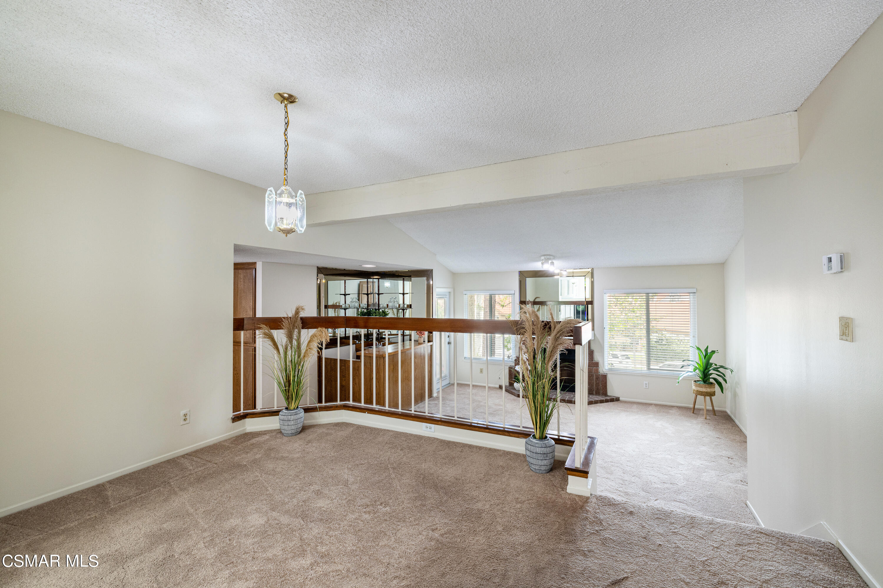 3330 Darby Street, Unit 409 Simi Valley, CA 93063 - Photo 7 of 27 a view of a livingroom with a furniture and a chandelier