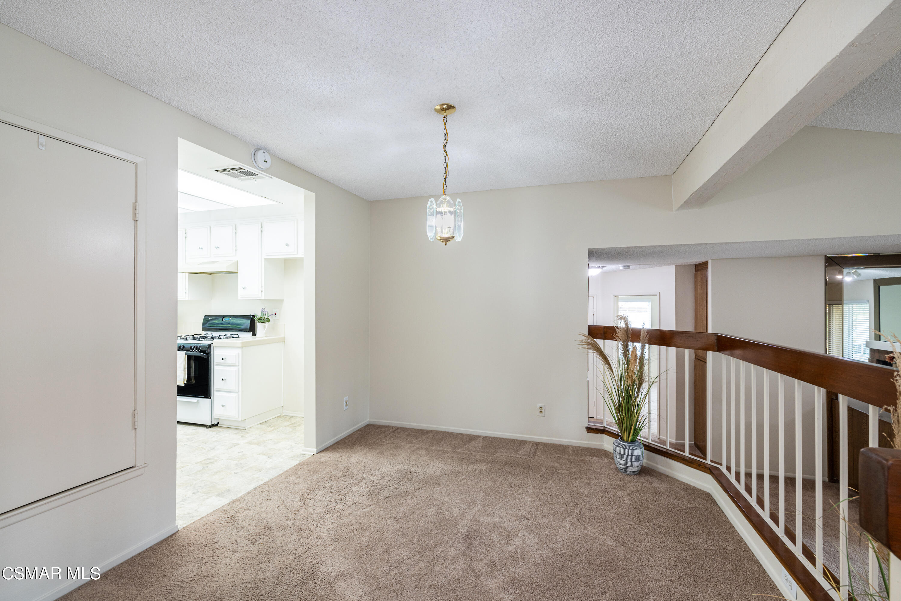 3330 Darby Street, Unit 409 Simi Valley, CA 93063 - Photo 8 of 27 a view of a hallway with an entryway and livingroom