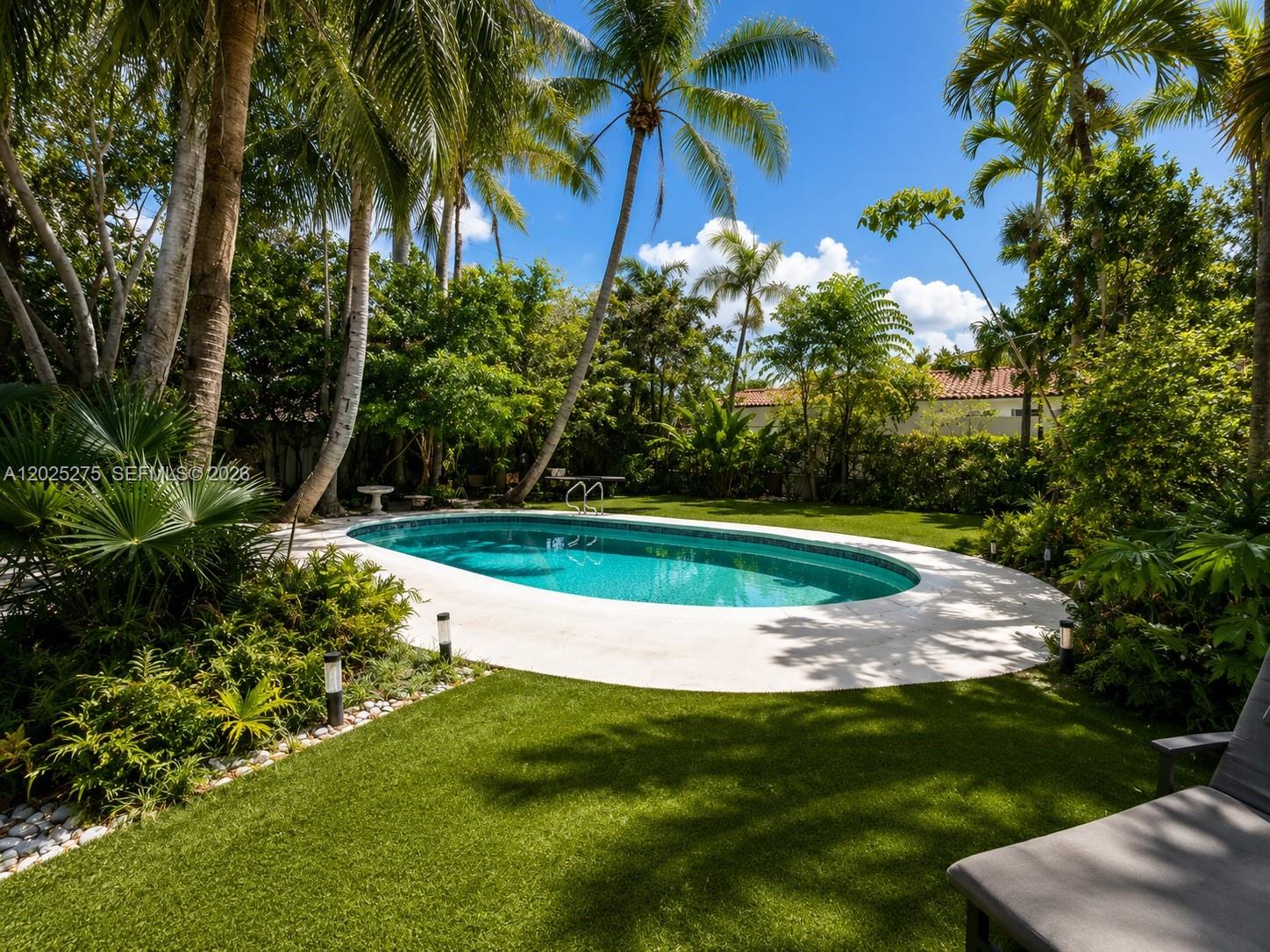 1329 Tyler Street Hollywood, FL 33019 - Photo 4 of 10 a view of a golf course with a palm tree