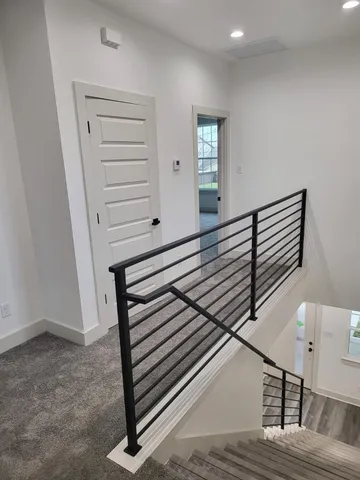 a view of a hallway with staircase