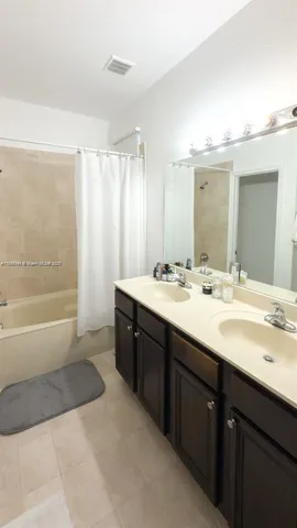 a bathroom with a shower and toilet
