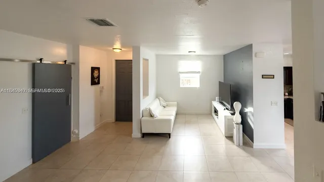 a living room with furniture and a table