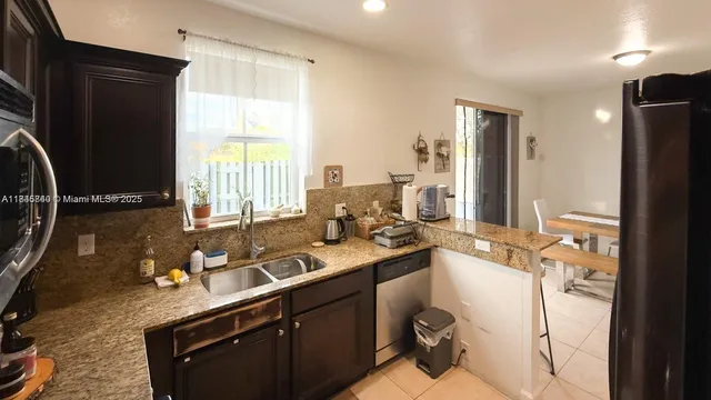 a bathroom with a sink double vanity and a mirror