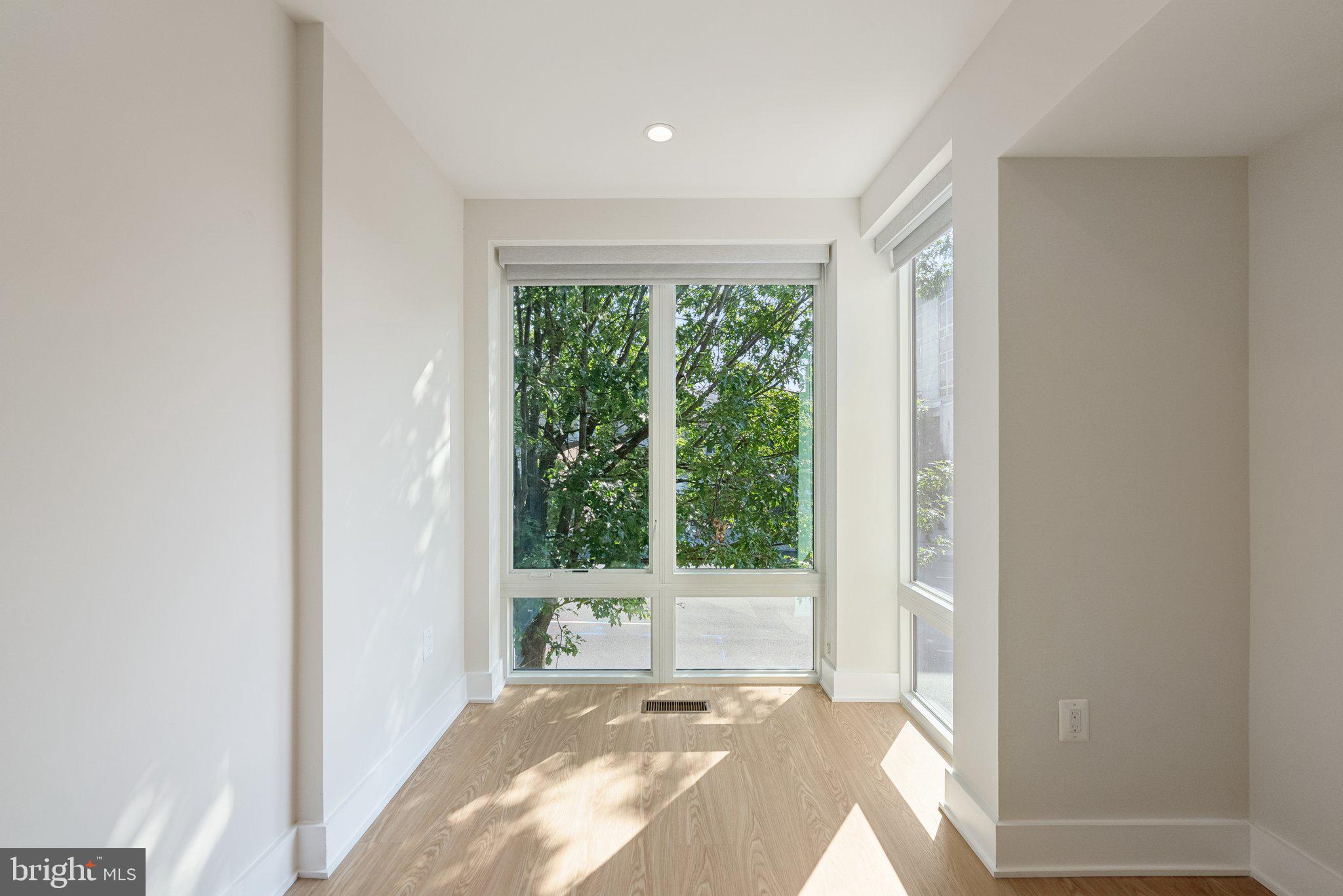 2134 Wisconsin Avenue Northwest, Unit 3 Washington, DC 20007 - Photo 11 of 40 a view of a room that has a bed and a window