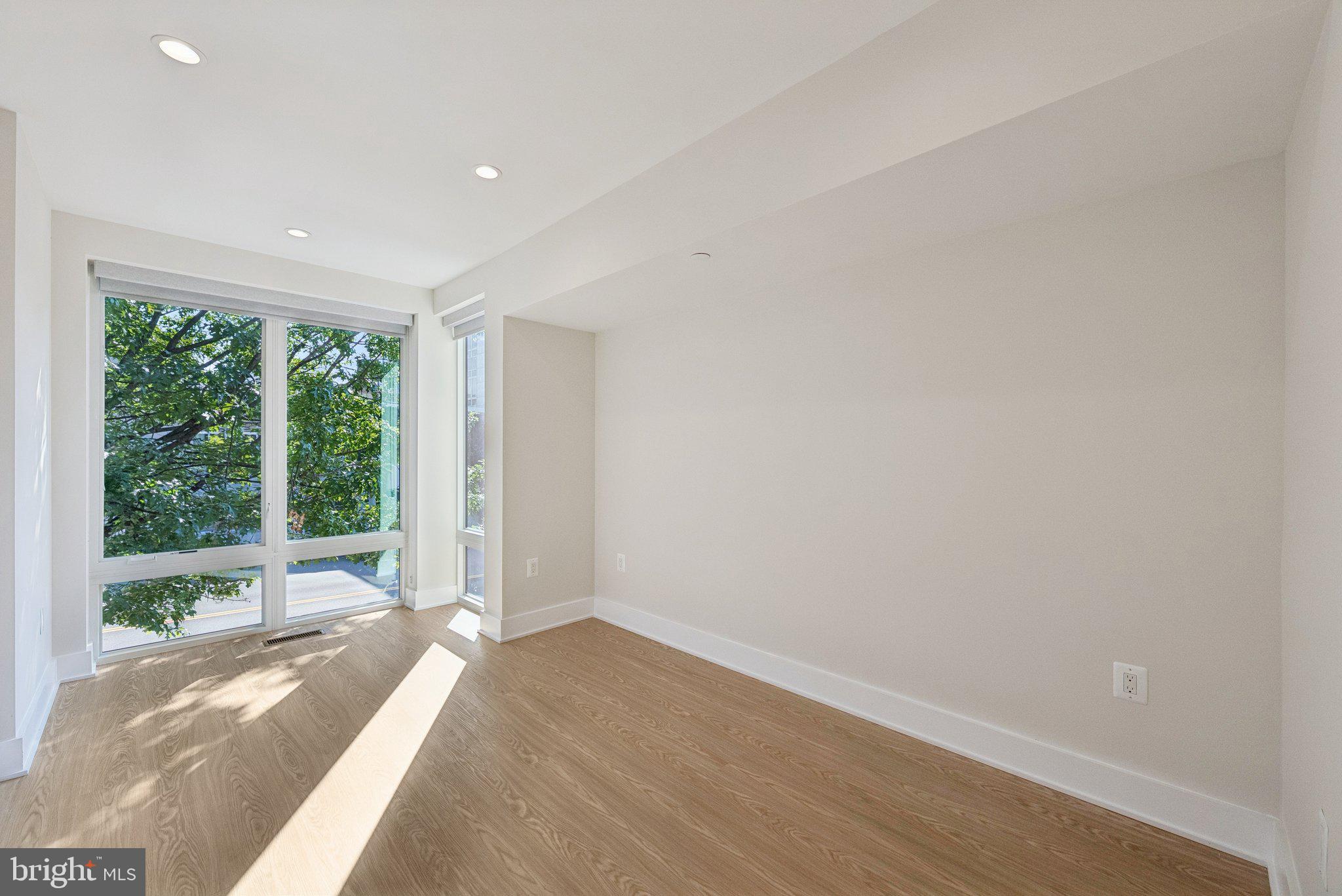 2134 Wisconsin Avenue Northwest, Unit 3 Washington, DC 20007 - Photo 14 of 40 a view of a room with a large window