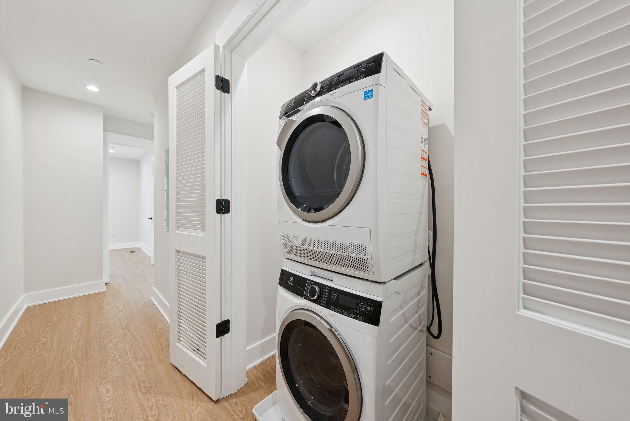 2134 Wisconsin Avenue Northwest, Unit 3 Washington, DC 20007 - Photo 23 of 40 a utility room with dryer and washer