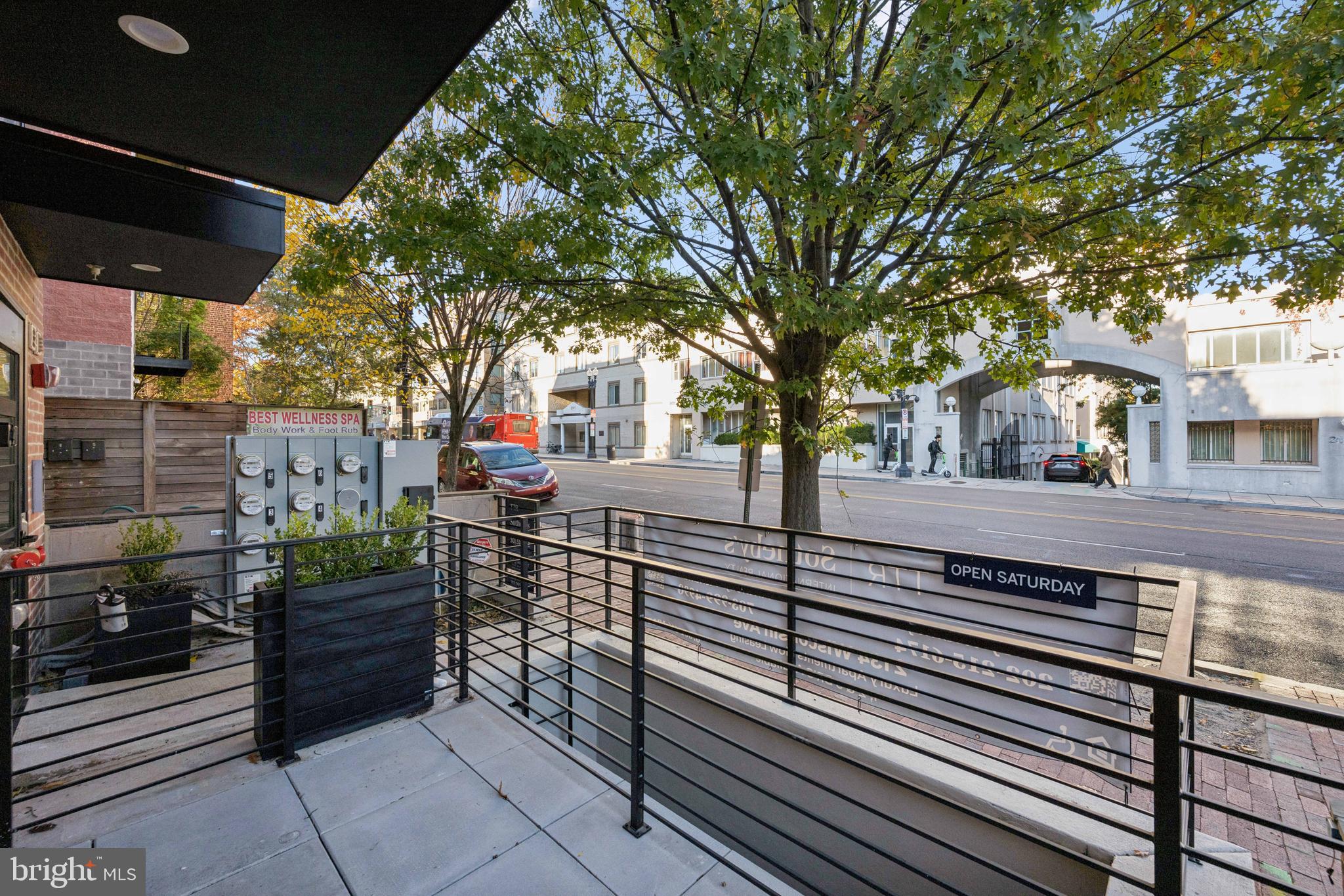 2134 Wisconsin Avenue Northwest, Unit 3 Washington, DC 20007 - Photo 26 of 40 a view of a patio with table and chairs and wooden fence