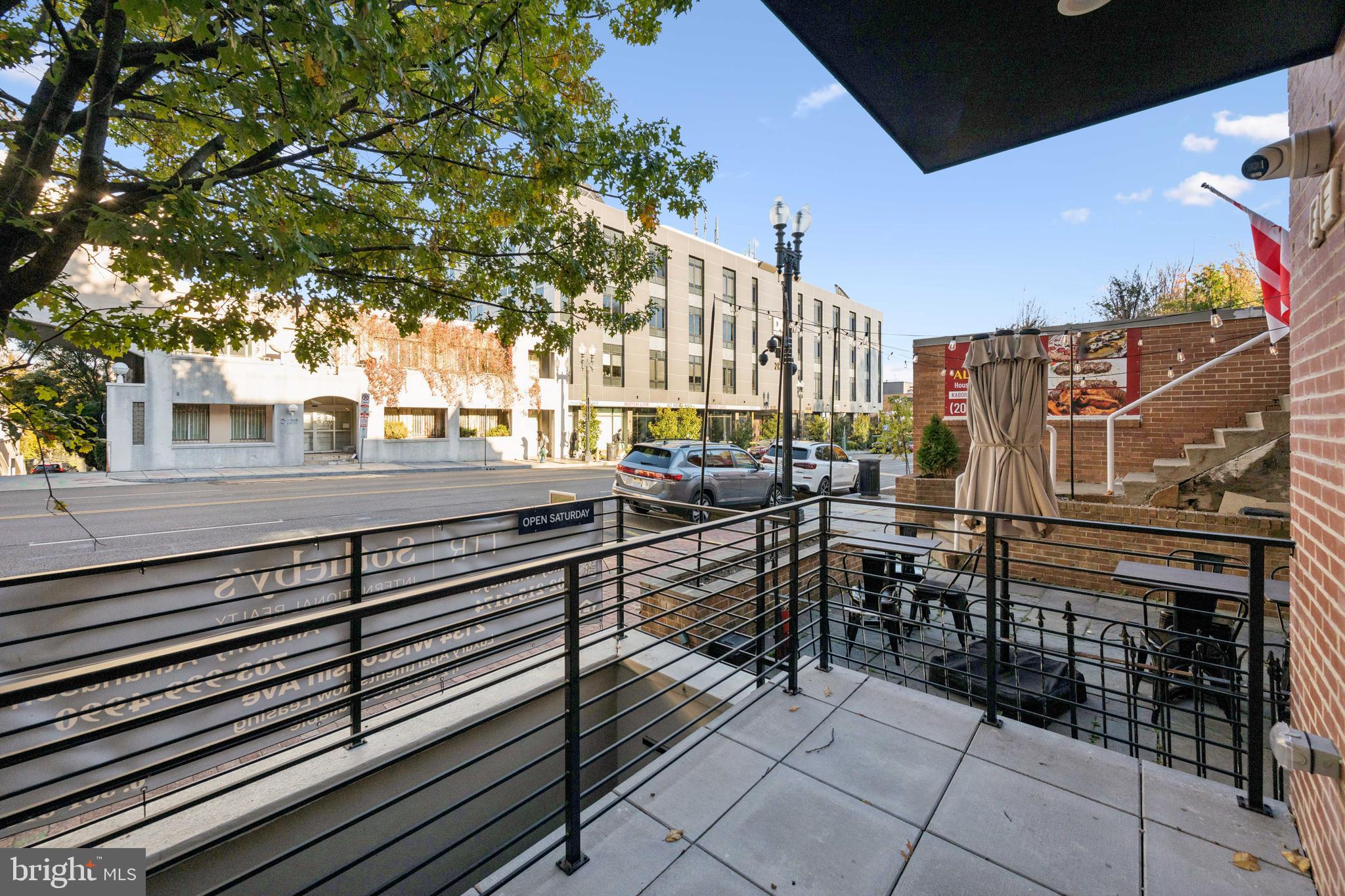 2134 Wisconsin Avenue Northwest, Unit 3 Washington, DC 20007 - Photo 27 of 40 a view of a patio with couches table and chairs and potted plants