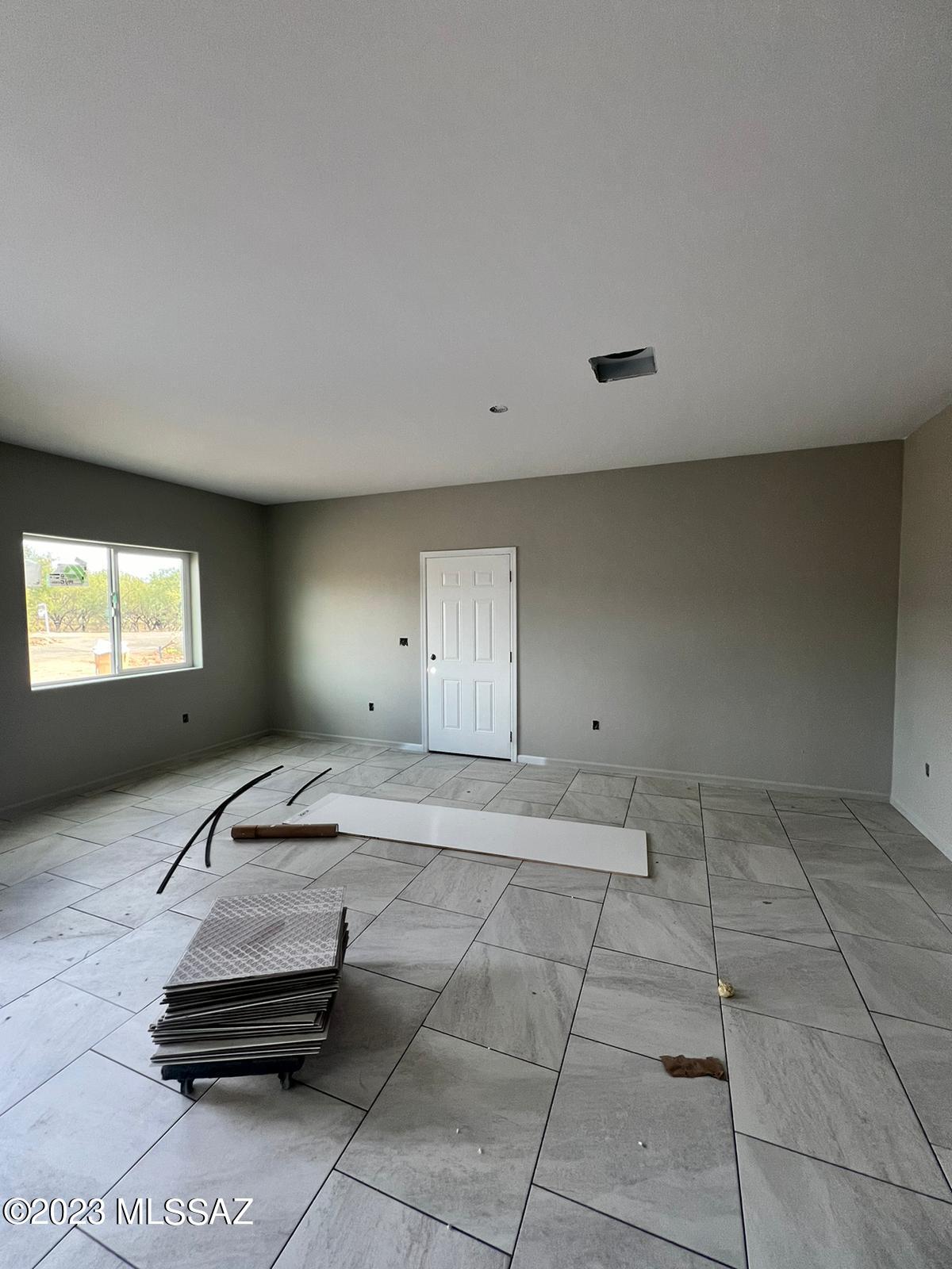 1830 Alpine Court Rio Rico, AZ 85648 - Photo 6 of 9 a living room with a couch and a window