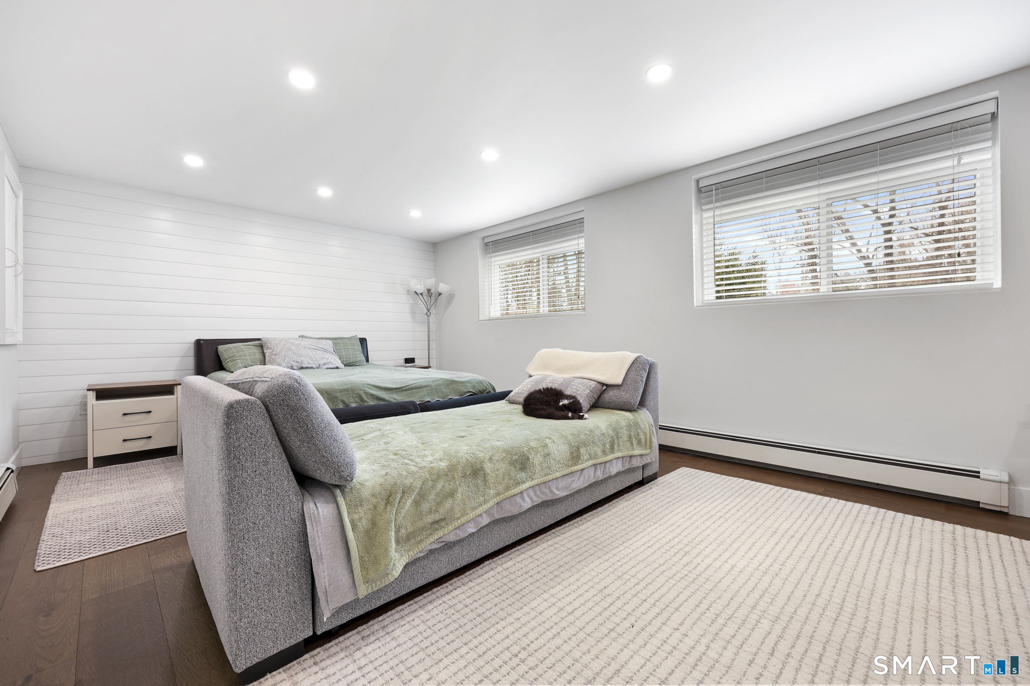 36 North Street Trumbull, CT 06611 - Photo 17 of 23 a bedroom with a bed and a night stand