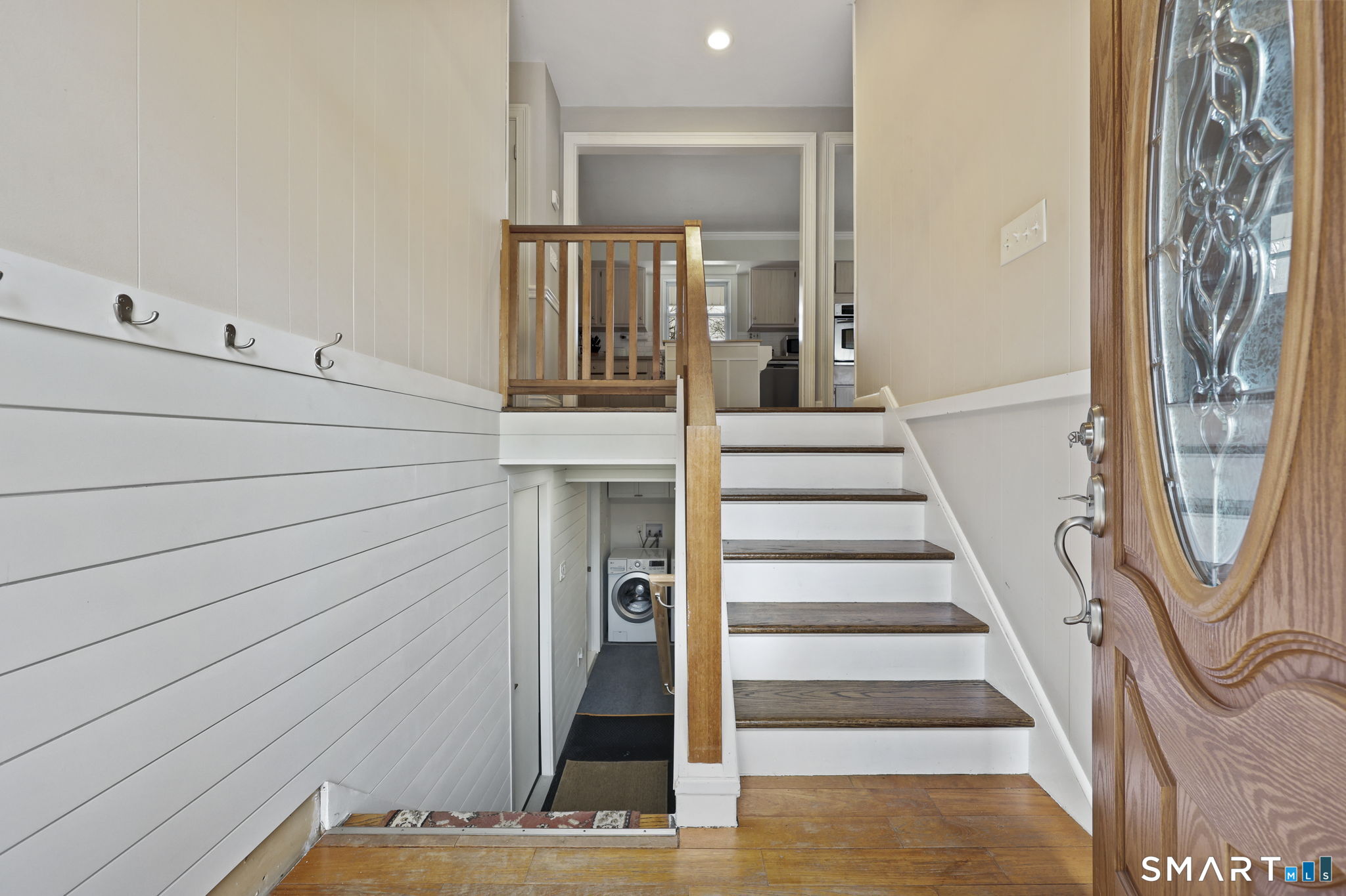 36 North Street Trumbull, CT 06611 - Photo 3 of 23 a view of a hallway with wooden floor and staircase