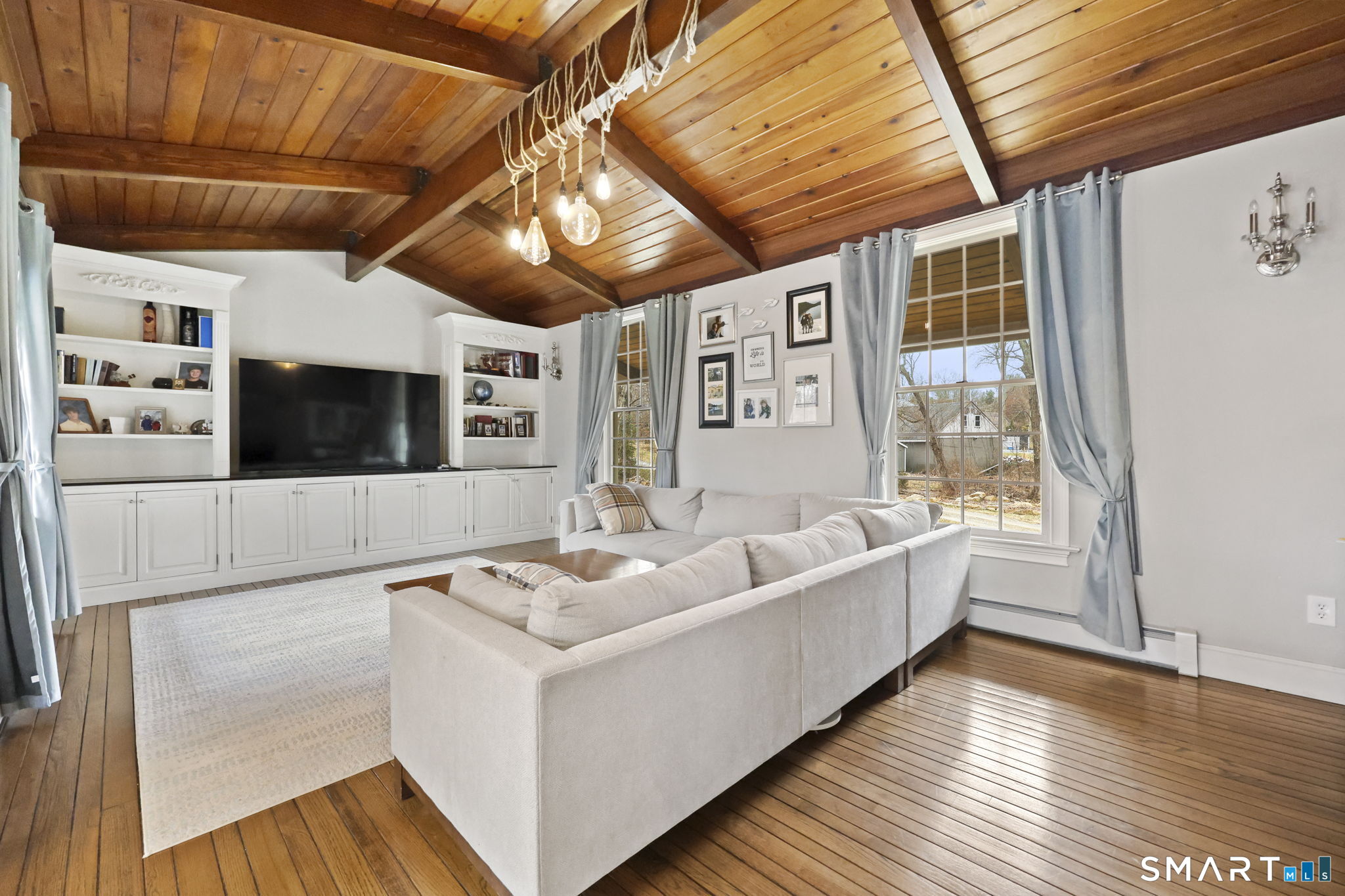 36 North Street Trumbull, CT 06611 - Photo 9 of 23 a living room with furniture and a flat screen tv