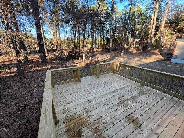 a view of a backyard and trees