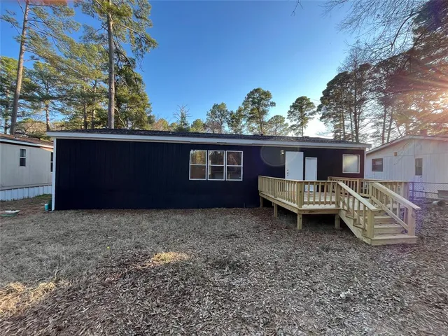 a house view with a backyard space