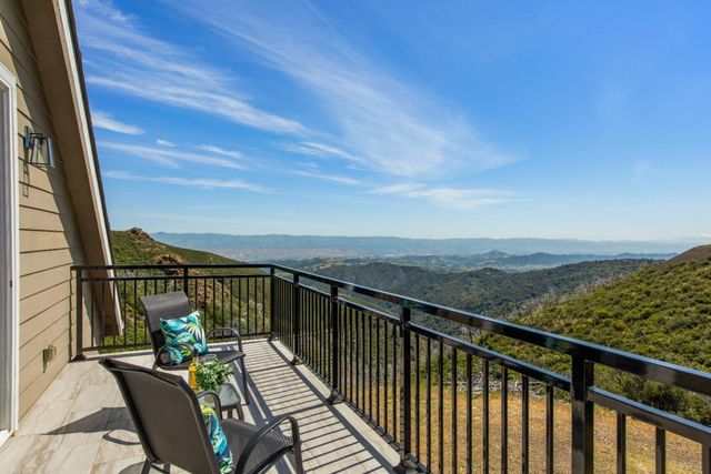 a spacious bathroom with a double vanity sink mirror and bathtub