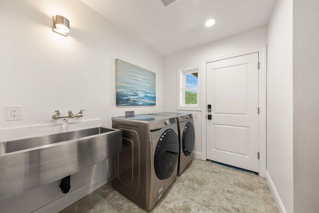 a front view of a house with a wooden fence