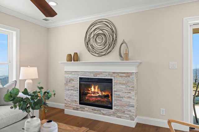 a view of fireplace with wooden floor