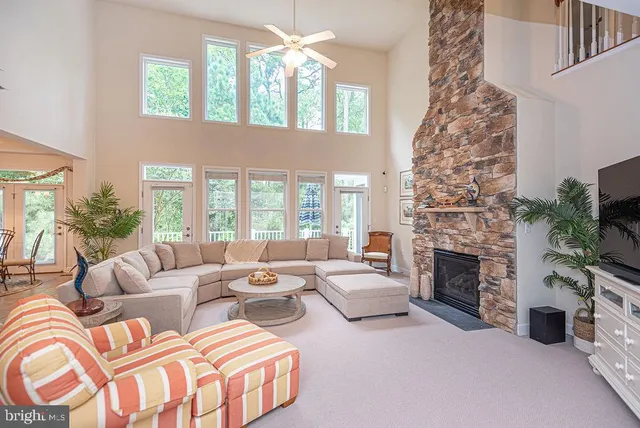 a kitchen with stainless steel appliances kitchen island granite countertop a sink counter space and cabinets