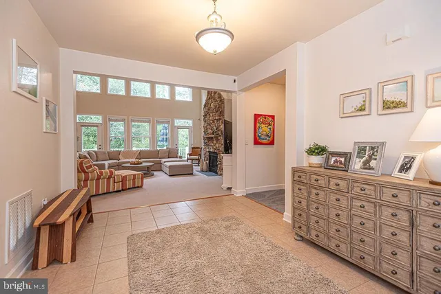 a kitchen with stainless steel appliances granite countertop a refrigerator a stove and a sink