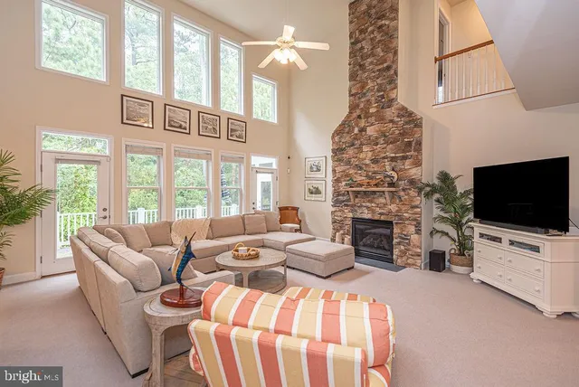 a kitchen with stainless steel appliances granite countertop a sink refrigerator and cabinets