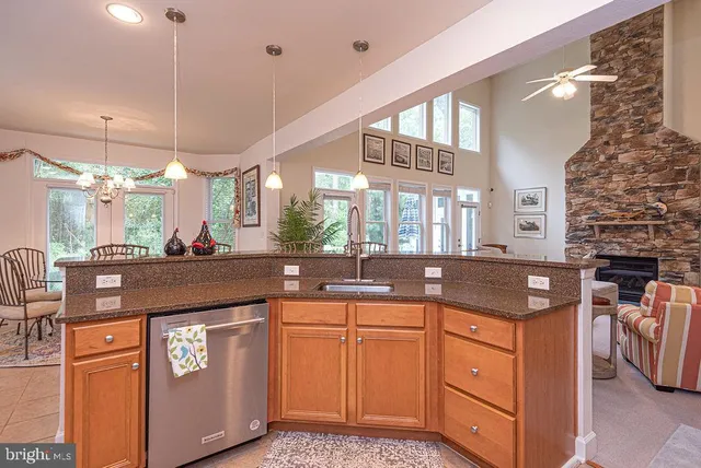 a white bath tub sitting in a spacious bathroom next to a window