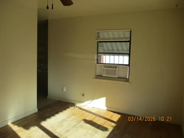 a view of an empty room and window