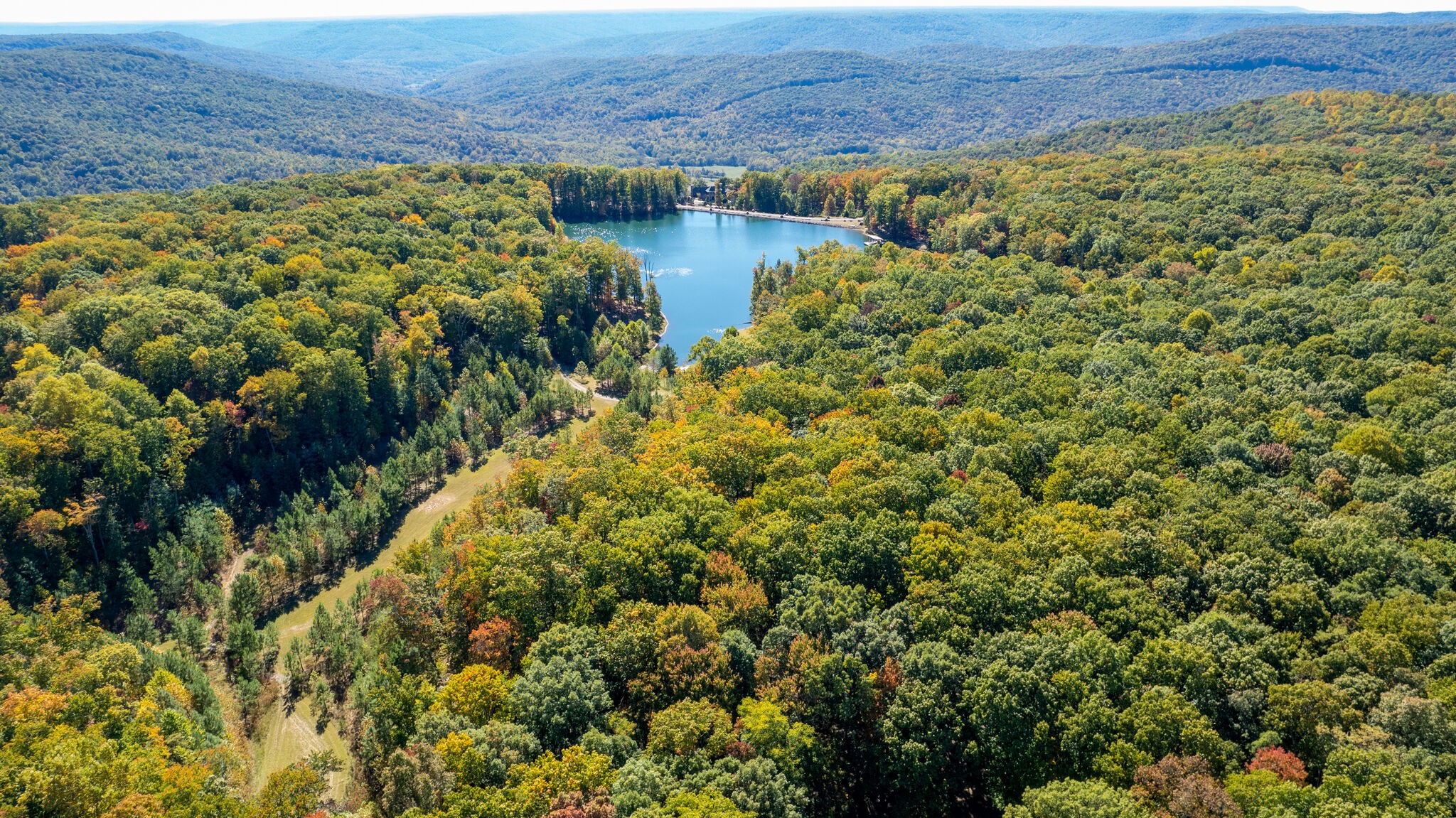 15 Myers Point Road Sewanee, TN 37375 - Photo 17 of 23 a view of a lake with a building in the background