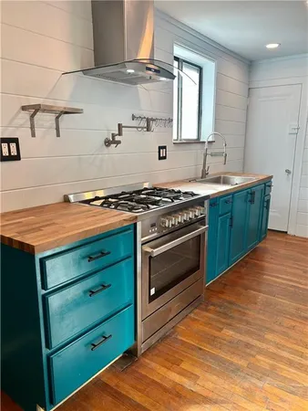 a kitchen with a stove and cabinets