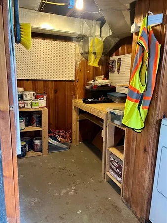 a utility room with stainless steel appliances and cabinets