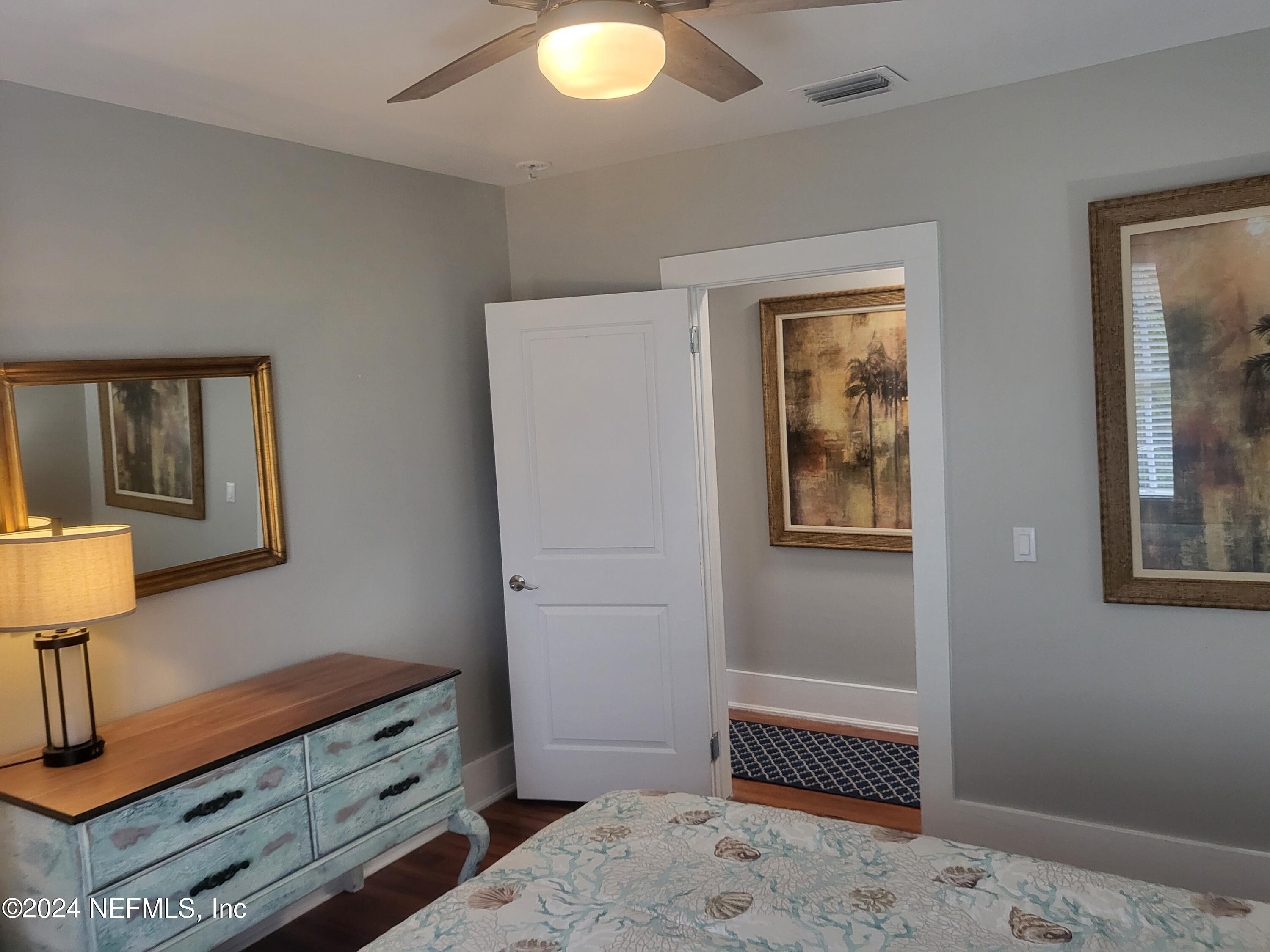 16 Rohde Avenue St. Augustine, FL 32084 - Photo 12 of 114 a bedroom with a bed and a lamp on dresser