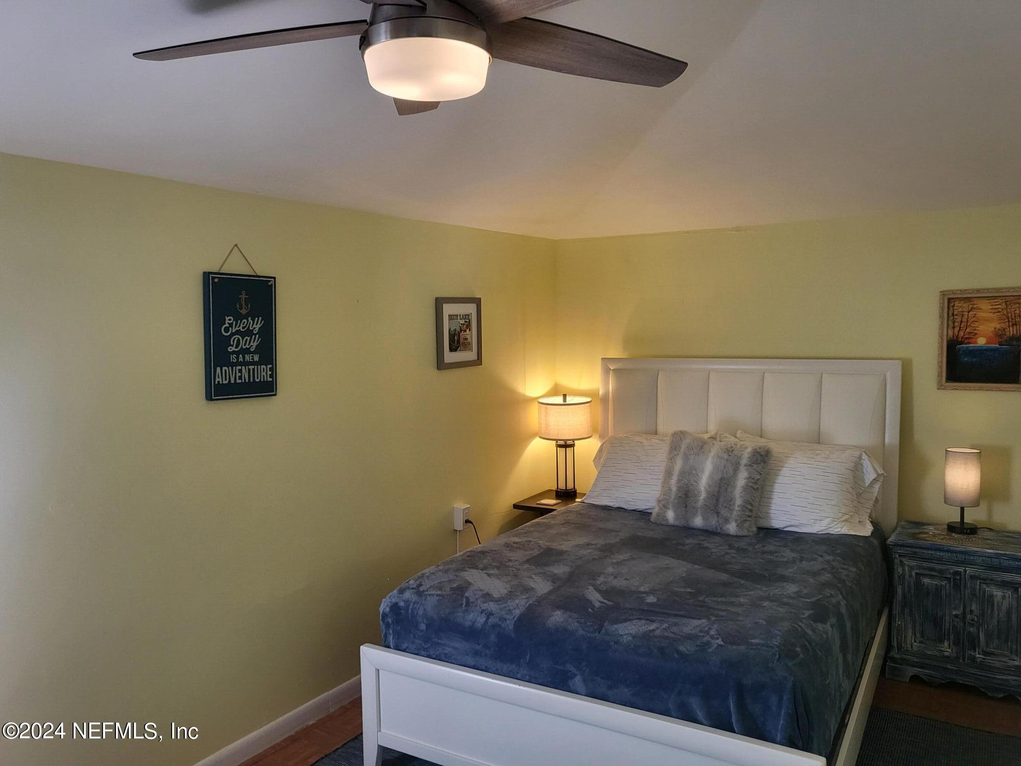 16 Rohde Avenue St. Augustine, FL 32084 - Photo 15 of 114 a bedroom with a bed and a lamp