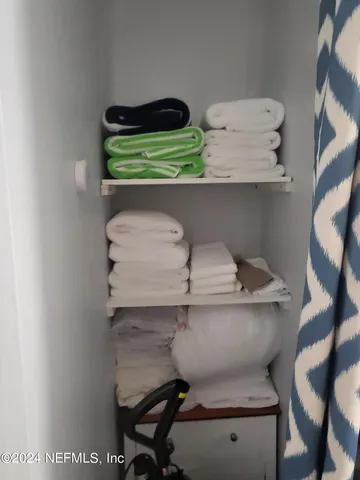 a kitchen with stainless steel appliances granite countertop a sink stove and a refrigerator