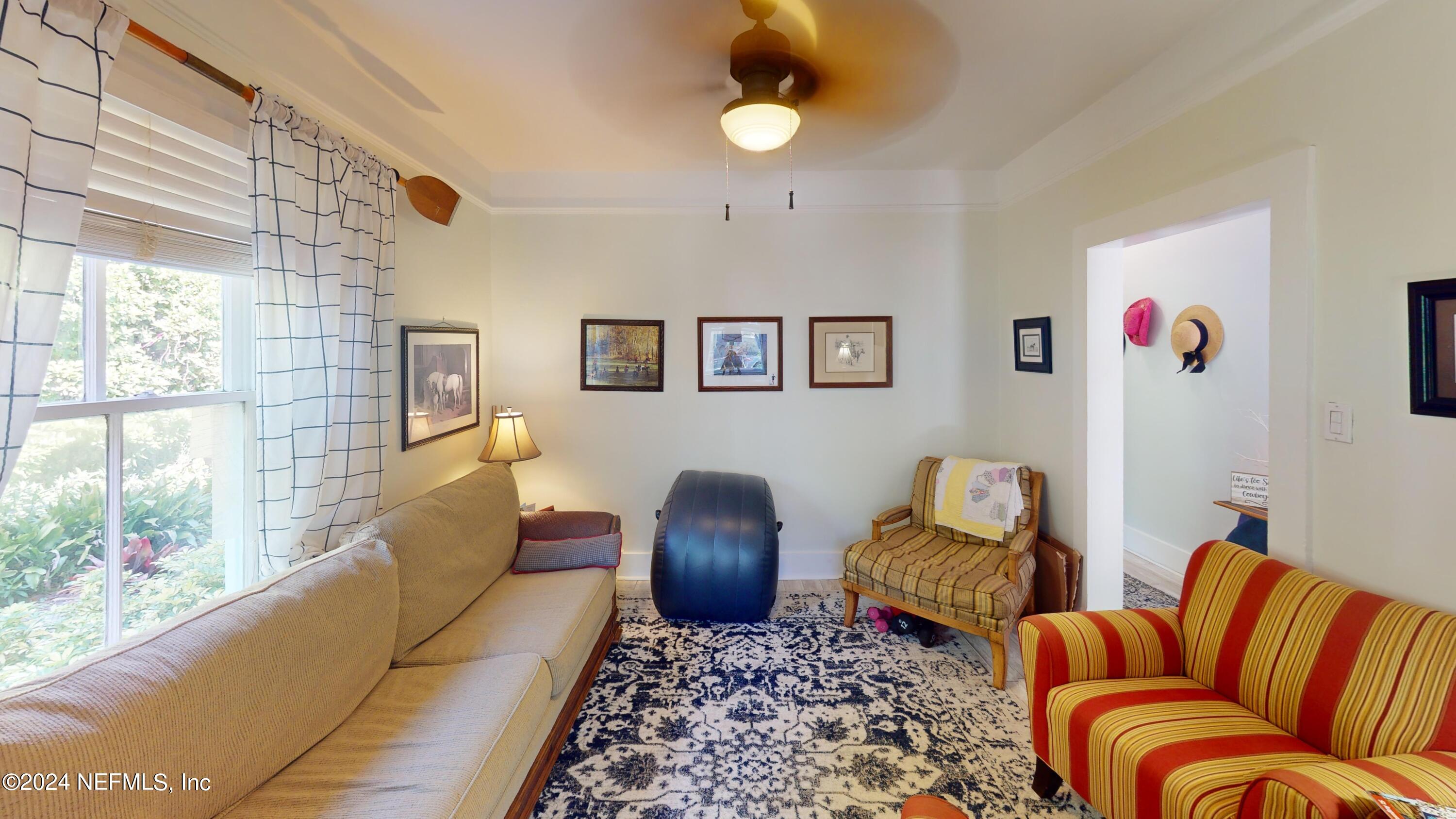 16 Rohde Avenue St. Augustine, FL 32084 - Photo 34 of 114 a living room with furniture ceiling fan and a window