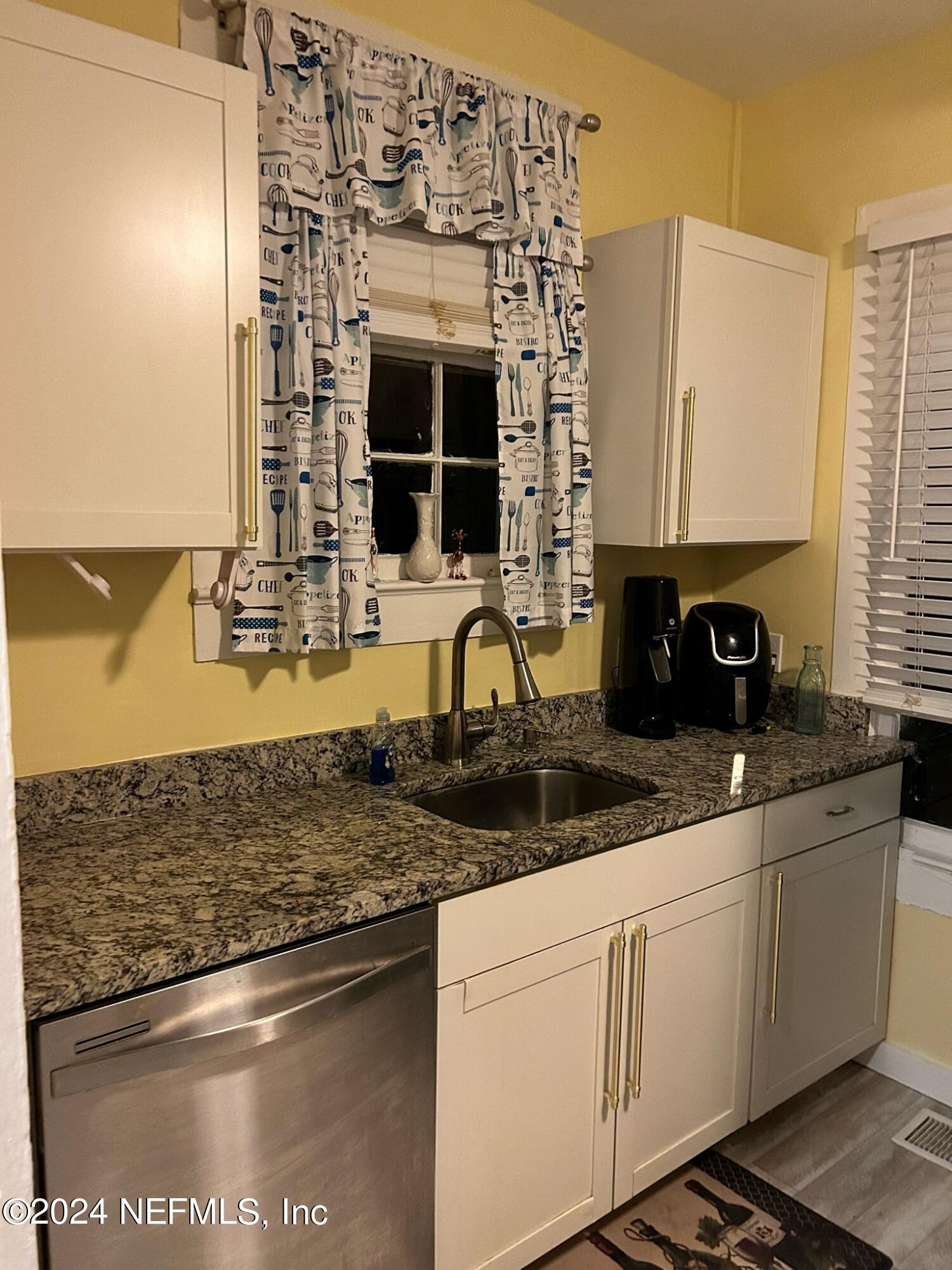 16 Rohde Avenue St. Augustine, FL 32084 - Photo 43 of 114 a kitchen with stainless steel appliances granite countertop a sink stove and microwave