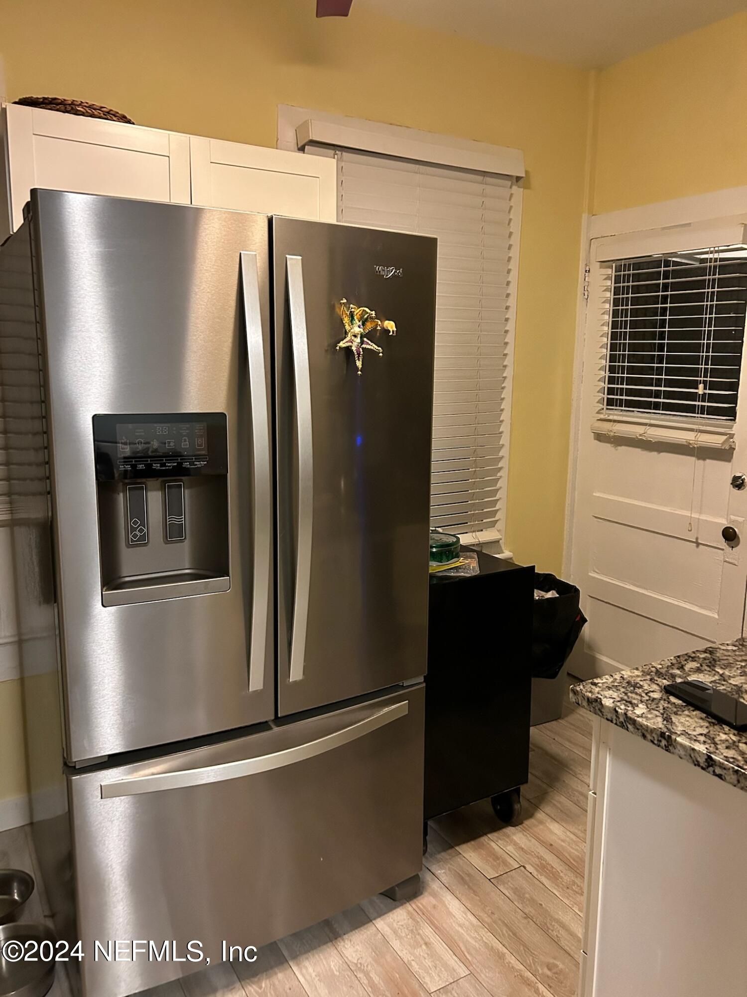 16 Rohde Avenue St. Augustine, FL 32084 - Photo 44 of 114 a view of a refrigerator in kitchen and a wooden floor