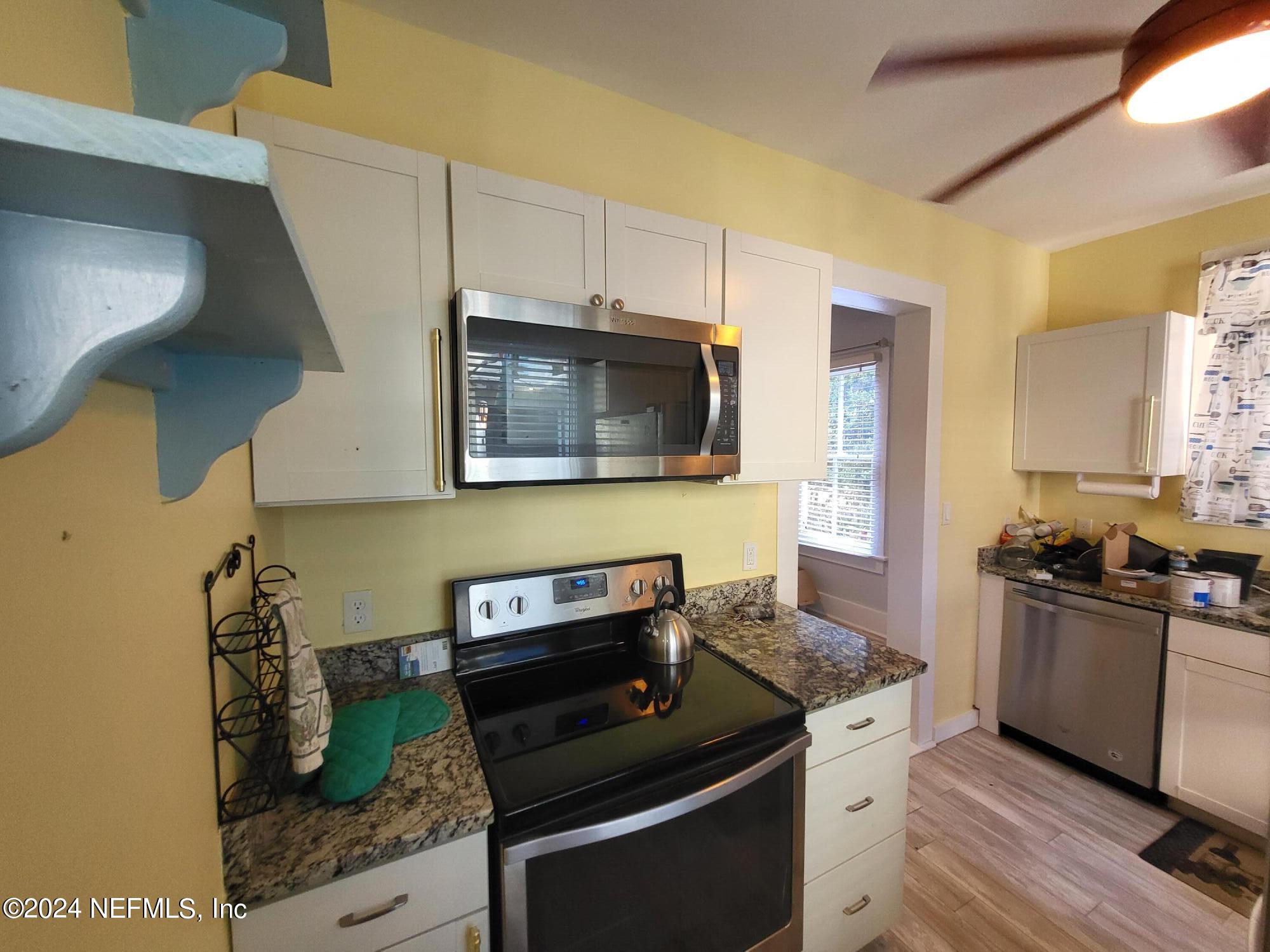16 Rohde Avenue St. Augustine, FL 32084 - Photo 46 of 114 a kitchen with a stove and a microwave