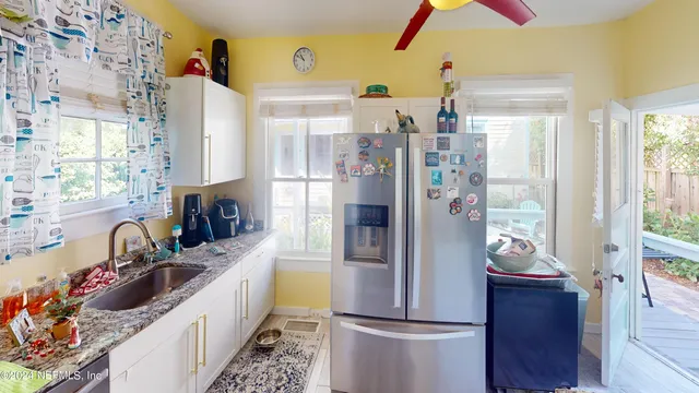 a view of a house with a yard and sitting area