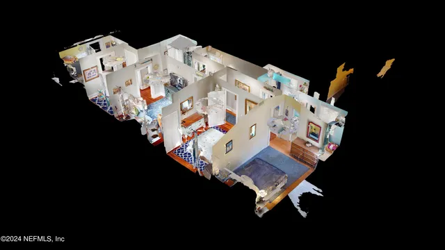 a bedroom with a bed and a lamp on dresser