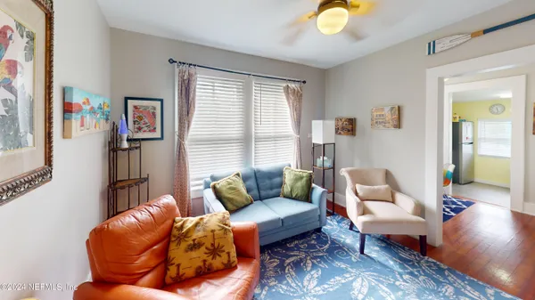 a bedroom with a bed and a lamp