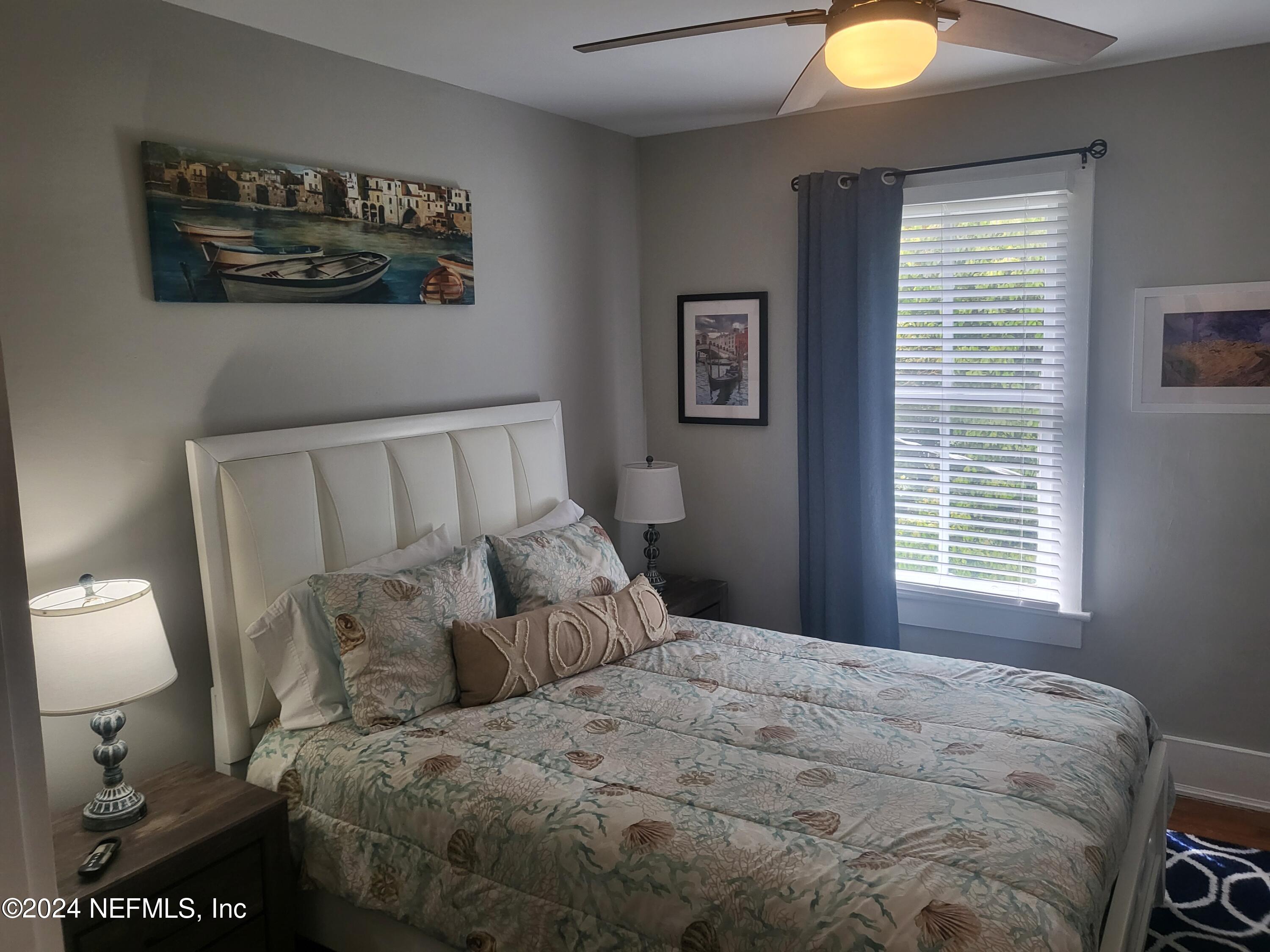 16 Rohde Avenue St. Augustine, FL 32084 - Photo 10 of 114 a bed sitting in a bedroom next to a window
