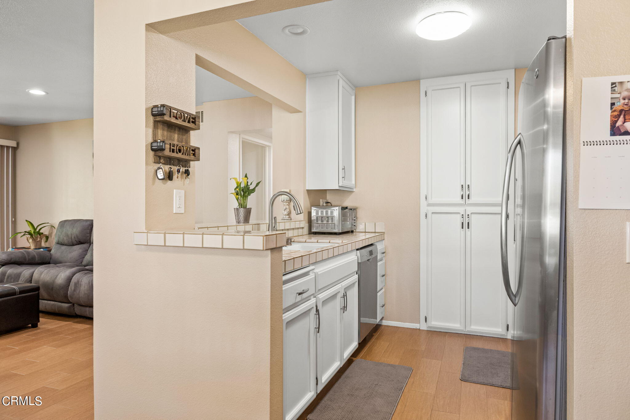 1965 Majorca Drive, Unit 237 Oxnard, CA 93035 - Photo 15 of 50 a bathroom with a double vanity sink and a mirror