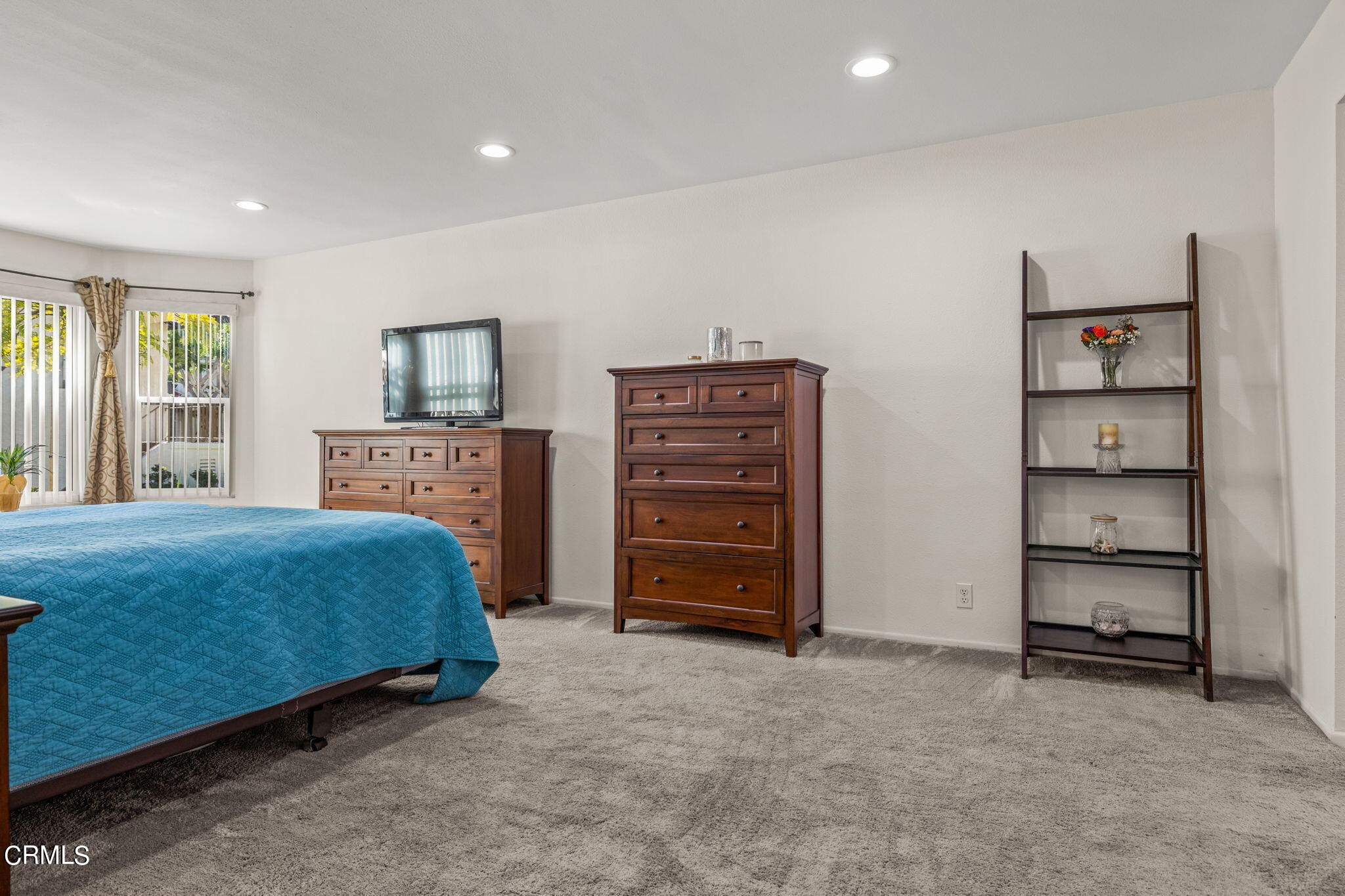 1965 Majorca Drive, Unit 237 Oxnard, CA 93035 - Photo 22 of 50 a bedroom with a bed and a television