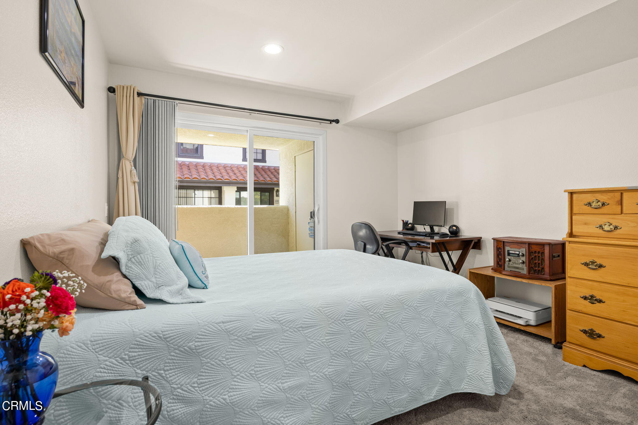 1965 Majorca Drive, Unit 237 Oxnard, CA 93035 - Photo 28 of 50 a bedroom with a bed and large windows