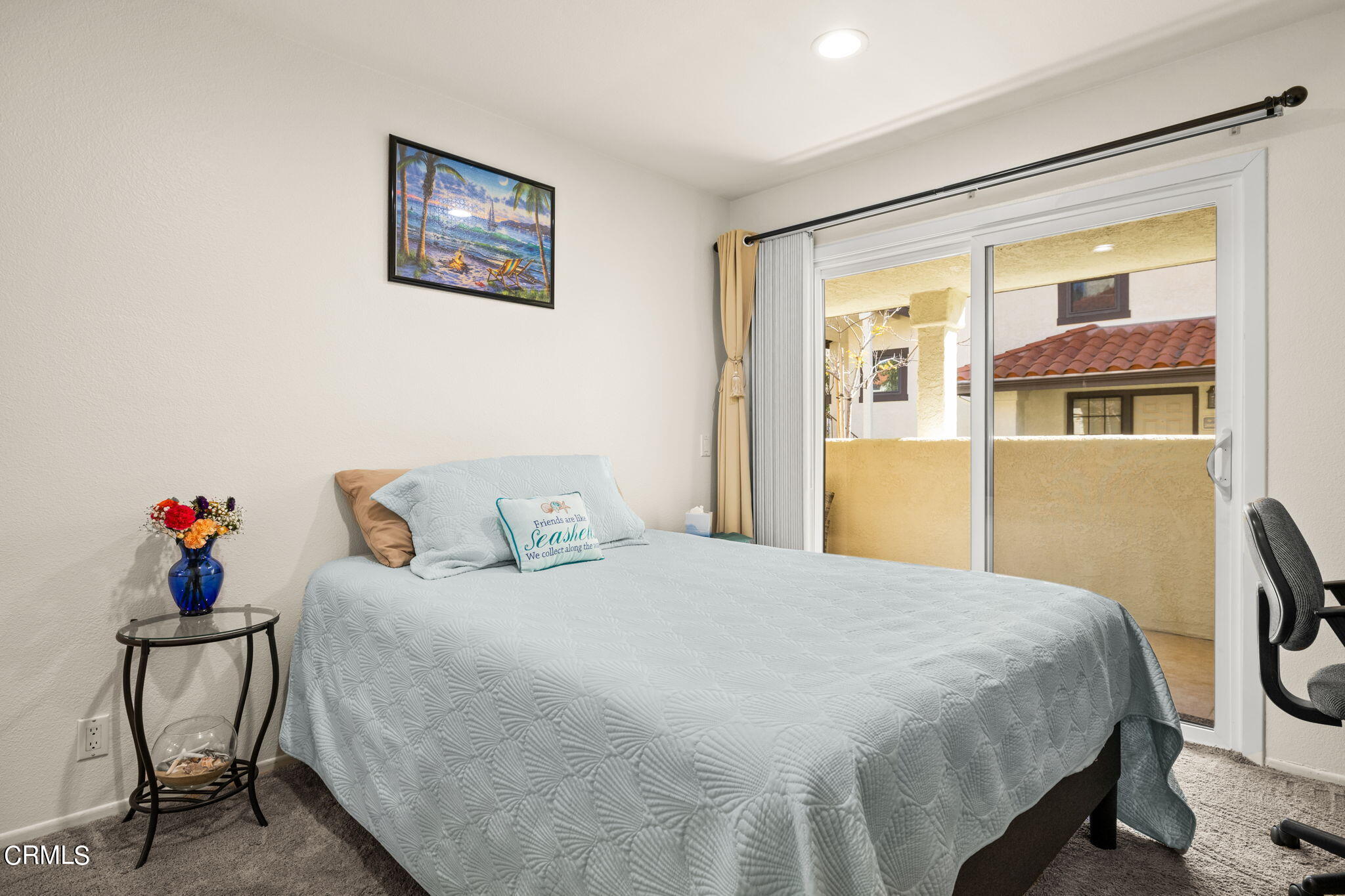 1965 Majorca Drive, Unit 237 Oxnard, CA 93035 - Photo 29 of 50 a bedroom with a bed and wooden floor