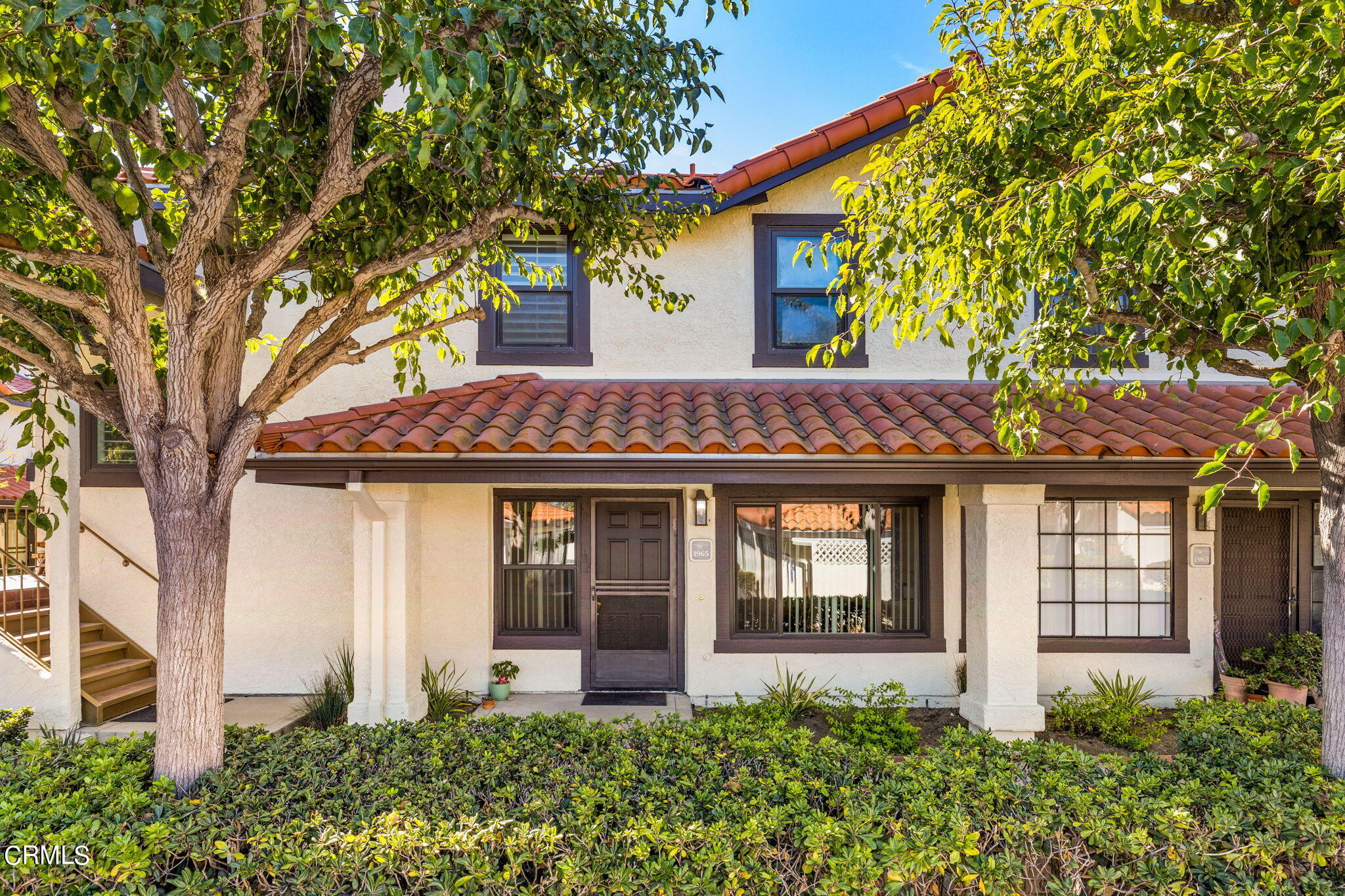 1965 Majorca Drive, Unit 237 Oxnard, CA 93035 - Photo 3 of 50 a front view of a house with garden