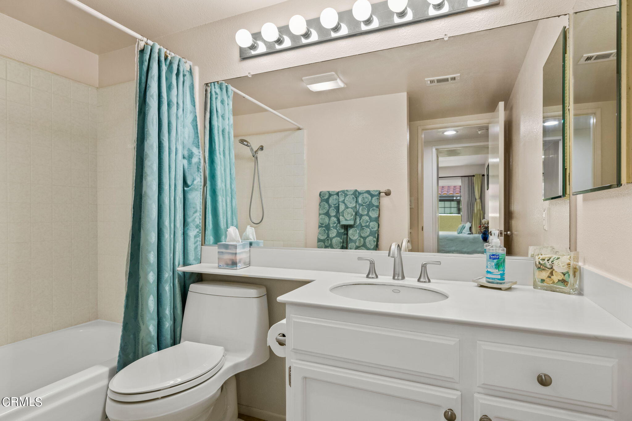 1965 Majorca Drive, Unit 237 Oxnard, CA 93035 - Photo 31 of 50 a bathroom with a sink a toilet and mirror