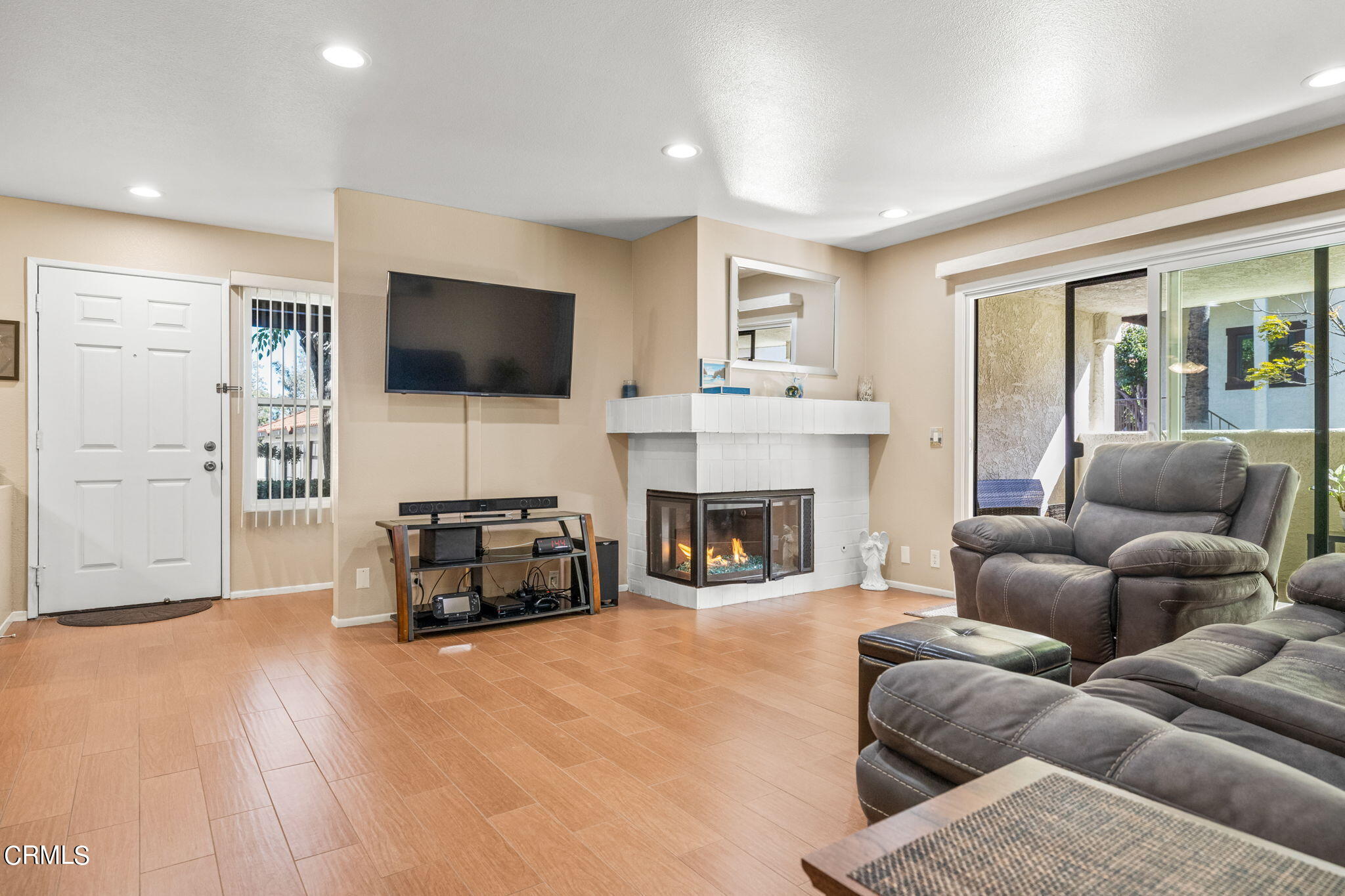 1965 Majorca Drive, Unit 237 Oxnard, CA 93035 - Photo 9 of 50 a living room with furniture a flat screen tv and a fireplace