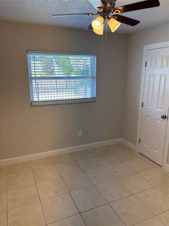 1610 Hinckley Road Orlando, FL 32818 - Photo 7 of 10 a view of an empty room with a window